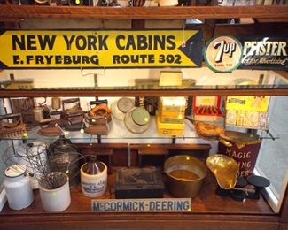Advertising signs, irons, storage jars, crocks, scale, country store items, etc