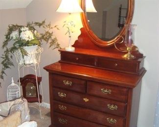 Cherry chest of drawers with attached oval mirror and two hankie drawers & etc.
