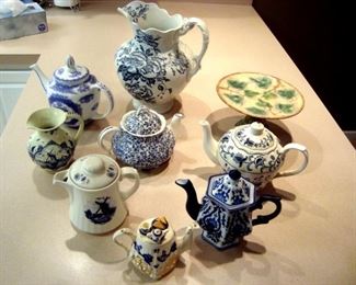 Some of the 35 teapots and a Griffin Smith & Hill Majolica sake stand.