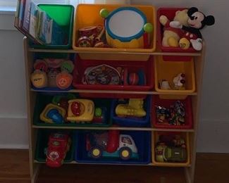 Toy storage (toys not included), area rug, nursery