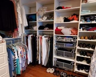 Large closets filled with clothing, shoes, purses etc