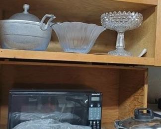 Small kitchen appliances. Several serving dishes as well. 