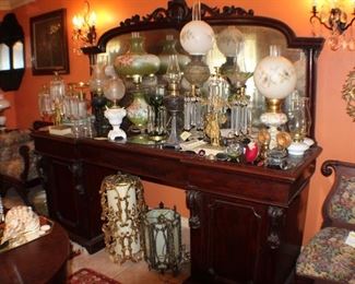 pedestal sideboard, or back bar, mid 1800's hand-cut dovetails, large mirror back with heavily carved crest. center drawer, left cabinet has slide-out shelves, right cabinet is partially zinc-lined and fitted for bottles