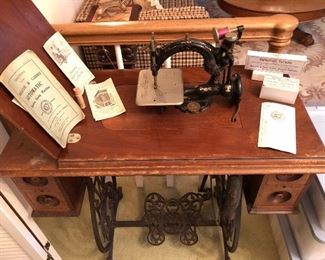 sewing machine in cabinet with owners manuals. You've  got to see this in person, darned cute!