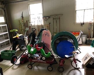  exercise trampoline, wagon, inch worm ride on toy, boogie boards, tricycle, lawn seeder, trash cans,dirt devil vacuumn, tools