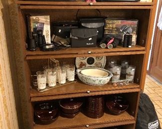 boom boxes, binoculars, new night vision pair,vintage glasses in carriers, bowls, barrister bookcase pair, brown crockware, coleman twin air mattress