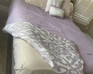 Reversible queen comforter set with decorative pillows and shams