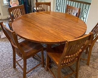 Bar height table with 6 chairs. Solid wood. 60 inches round 