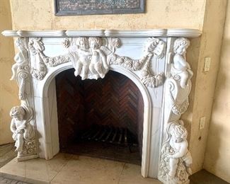 Ornately carved fireplace 80” wide by 55” tall by 12” deep