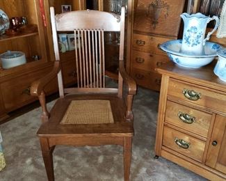 Set of "6" Matching Oak cane-bottom chairs (1 chair with arms) 