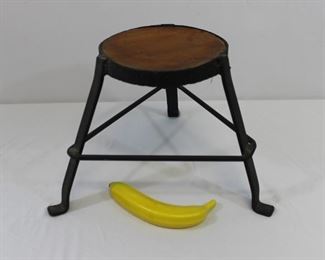 Primitive hand-made hammered iron and wood stool
