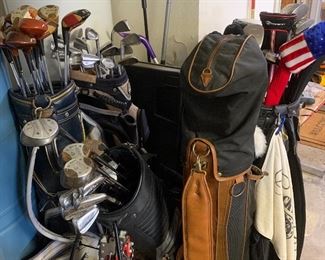 Dozens of golf clubs, golf bags and other golf supplies