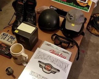 Harley items: boots, books, goggles, puzzle, playing cards, beer mug, etc.