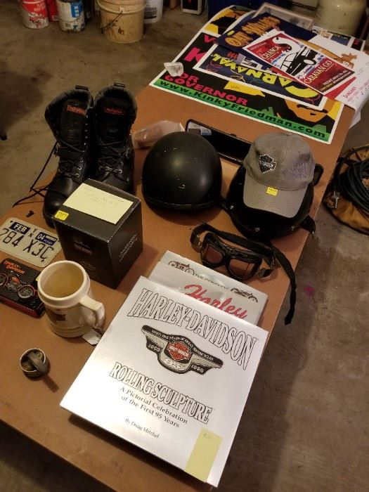 Harley items: boots, books, goggles, puzzle, playing cards, beer mug, etc.