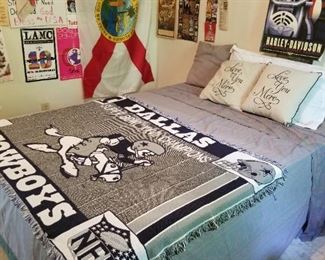 Other queen bed with Dallas Cowboys throw.