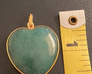 $140 - jade heart bezeled in 18kt yellow gold and bail