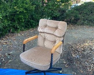 Detail of the light brown cloth swivel dining chair. Total of 6 chairs available. Spare wheels included. (WAS $20 EACH, NOW $10 EACH!!) PLEASE TAKE ALL 6 AS A SET!!
