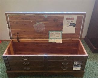 Inside the Lane cedar lined chest. Lane cedar lined chest, brand new condition, still has the plastic wrap on the cloth top bench! Key included for the lock.