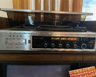 VINTAGE Zenith stereo system with 8-track player and multi-stack album turntable. AM/FM receiver. 2 speakers included. Radio still works!