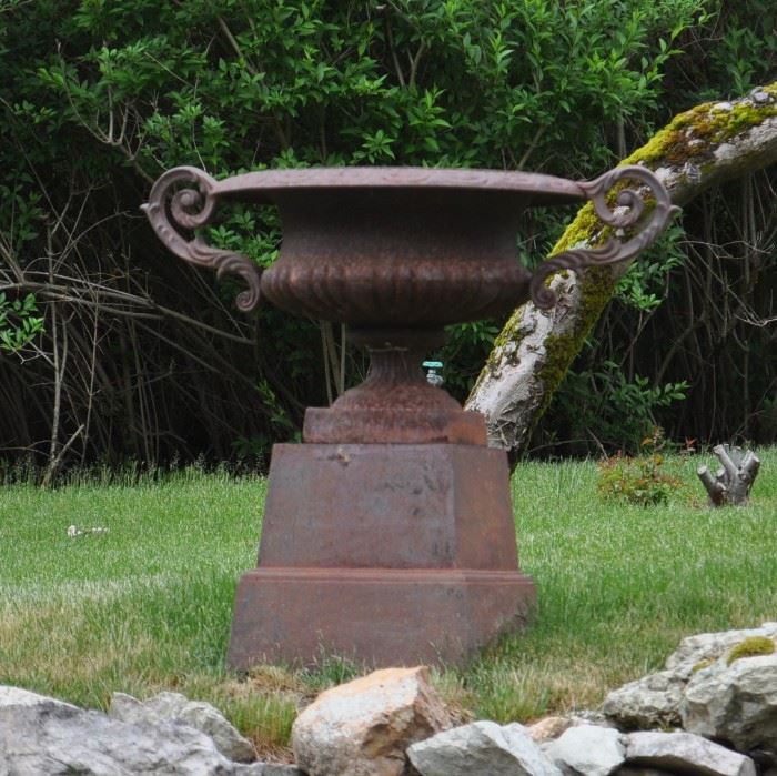 Giant urn on pedestal. Back yard. Urns are all singles!!