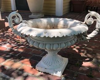 White urn, there is an additional  pedestal base available, but it appears it is not a snug fit. 