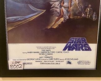 Lot 8002.  $225.00. Star Wars 1977 20th Century  Fox movie poster replica in double edge frame. "A Long Time ago, in a Galaxy far far away..."	31" W x 43" T	