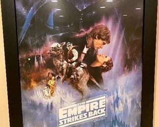 Lot 8004. $175.00   Star Wars 1995, 'The Empire Strikes Back'  movie poster, rteplica ..the Star Wars Saga Continues in double edge, black frame.	30" W x 43" T	