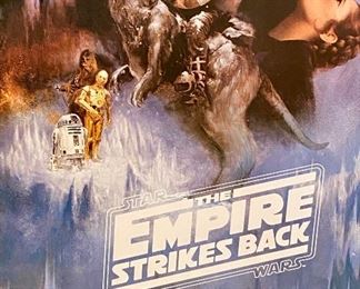Lot 8004. $175.00   Star Wars 1995, 'The Empire Strikes Back'  movie poster, rteplica ..the Star Wars Saga Continues in double edge, black frame.	30" W x 43" T	