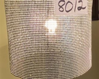 Lot 8012.  $75.00  Chrome base floor lamp with silver sequin shade (12" Diam),  sliding dimmer switch.  63" T, base is 10" Diam shade.