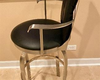 Lot 8014. $400.00. ($100.00 Ea) 4  black leather, swivel stools with brushed metal frame.  Seat Ht 30", stool 45" T and 21" W.   We can split this lot into Two Lots of 4 Stools.