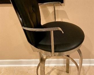 Lot 8014. $400.00. ($100.00 Ea) 4  black leather, swivel stools with brushed metal frame.  Seat Ht 30", stool 45" T and 21" W.   We can split this lot into Two Lots of 4 Stools.