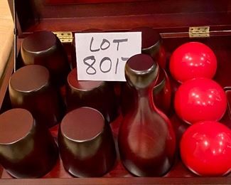 Lot 8017.  $75.00 Bombay Co. Bowling set in deluxe Wooden Box with brass hardware.  Also called Lawn Skittles or 9 pin, the set includes 9 wooden pins, 3 balls and a chalkboard for keeping score. Heavy at 36 pounds.  	18.5" x 13" x 11" T