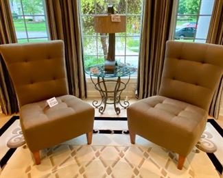 Lot 8026. $575.00  2 striking slipper style,, with tufted upholstery accent chairs in a Silk Bronze fabric by Precedent, legs are a walnut stain.	26" W x 35" D x 40" T. Paid over $1,150 for the Chairs.