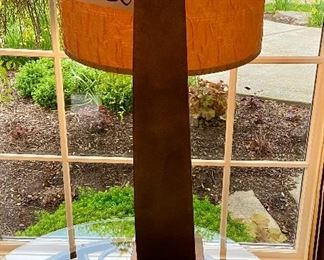 Lot 8030.  $175.00  Brayden Studios Table lamp with curved metal/iron body and suspended shade.	32" T x 21" D	Original cost was $438 for this Table lamp. Completely sold out.
