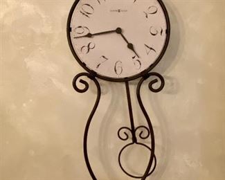 Lot 8045  $40.00  Howard Miller Wall Clock with Pendulum, battery powered.  33" T x 12" W