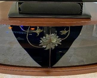 Lot 8062 $575.00 Stunning Corner Media/TV Stand with Premium Wood and Smoked Glass 2 Door Curved Glass Front and 2 Side Storage with Wood Doors.  Glass doors are reflecting the carpet pattern.  	62" W x 22" D x 23" T