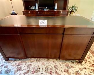 Lot 8069 $4200.00  Executive Home/Office Suite by Sligh. Includes Leather Top Wooden  Desk with Black Leather Top, Matching Credenza/Hutch and Lateral File Cabinet.  In Great Condition overall, Features lots of storage, file drawers, Keyboard Drawers. Cherry or Mahogany. Owner Paid over $10,000 for the set and it is elegant.	Desk 66" W x 32" D x 30" T, Credenza 73" W x 24" D x 82" T (30" T for Base and 52" T for Hutch).  This is truly the nicest Office Suite we had.  Don't Miss this absolute Bargain.