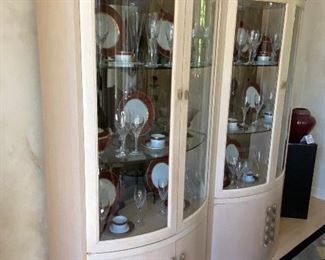 Lot 8076. $1750.00. Two Century Side-by-Side Lit Display/China Cabinets with Curved Glass Front Doors and Lower Storage Behind Doors.  These Cabinets don't necessarily have to be used in the Dining Room, or even displayed next to each other. Very Stylish; goes well with Modern or Contemporary Design, and Century is an outstanding furniture manufacturer.  Contents not for sale. Each Cabinet 81" T x 38" W x 19" D