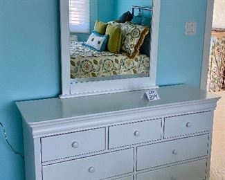Lot 8091  $750.00  Young America 7-Drawer Dresser, (Stanley) 56" W x 18" D  x 32.5" T, Arched Mirror, 32"  W x 45" T, and Two Matching Night Stands with single drawer atop an open bottom shelf. A Perfect for any age.  Dresser:  56" W x 18" D x 32" T,