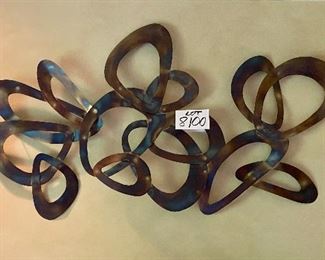 Lot 8100. $95.00. Metal Abstract Wall Art done in burnished metal.  43" w x 24" T.  Goes very well with a MCM decor.
