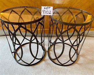 Lot 8102. $120.00. Pair of Modern glass top tables with metal drum base. 16" Diam.  x 22" T.  Sleek Design goes with MCM, Contemporary or Eclectic Traditional.  And they are different!  