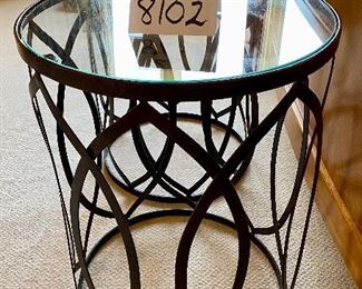 Lot 8102. $120.00. Pair of Modern glass-top tables with metal drum base. 16" Diam.  x 22" T.  Sleek Design goes with MCM, Contemporary or Eclectic Traditional.  And they are different!  