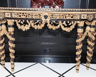 A Louis XIV Style Parcel Gilt Wood and Burl Walnut Demilune Console.  Last Quarter of the Twentieth Century. No Marks Evident.  Dimensions: Height 35 x width 71 x depth 24 inches.    $5,000.00

 


