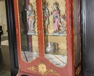 A French Louis XV Style Flame Mahogany and Gilt Vitrine. Last Quarter of the Twentieth Century.  Dimensions: Height 69 x width 37 ½ x depth 15 ½ inches.	  $3,500.00