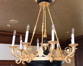 An Empire Style Gilt Metal Chandelier. Circa 2010-2013.  
Dimensions: Height 46 x width 30 inches approximately.	$5,000.00
