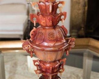 A Chinese Jadeite Censer. Likely Third Quarter of the Twentieth Century. No Marks Evident.                                               
The Chinese carved jadeite censer having a scrolled handle garlic form finial over lotus petal form graduated cups with rings set on the base of similar design, set on a wood base.
Dimensions: Height 18 inches.    $3,000.00
