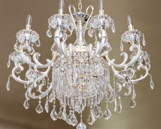 An American Silvered Leaded Glass Twelve Light Chandelier. Circa 2010-2013. No Marks Evident.

The chandelier in the Baccarat style having 12 electrified candles with silvered swag arms and multiple drops.
Dimensions: Height 33 x width 31 inches approximately.    $3,500.00
