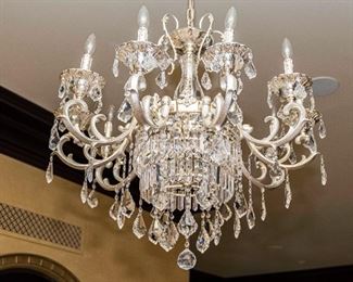 An American Silvered Leaded Glass Twelve Light Chandelier. Circa 2010-2013. 
The chandelier in the Baccarat style having 12 electrified candles with silvered swag arms and multiple drops.
Dimensions: Height 33 x width 31 inches approximately.	$3,000.00
