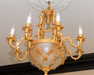 A Restauration Style Gilt Metal and Glass Eight Candle Chandelier. 
Dimensions: Height 36 x width 32 inches approximately.	$3,000.00
