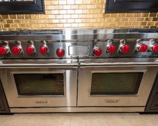 A Wolf Double Oven with Six Burner Grill and Ventahood Stainless Hood. No Serial Number Available. Circa 2013-2014.   Almost unused. $15,000.00